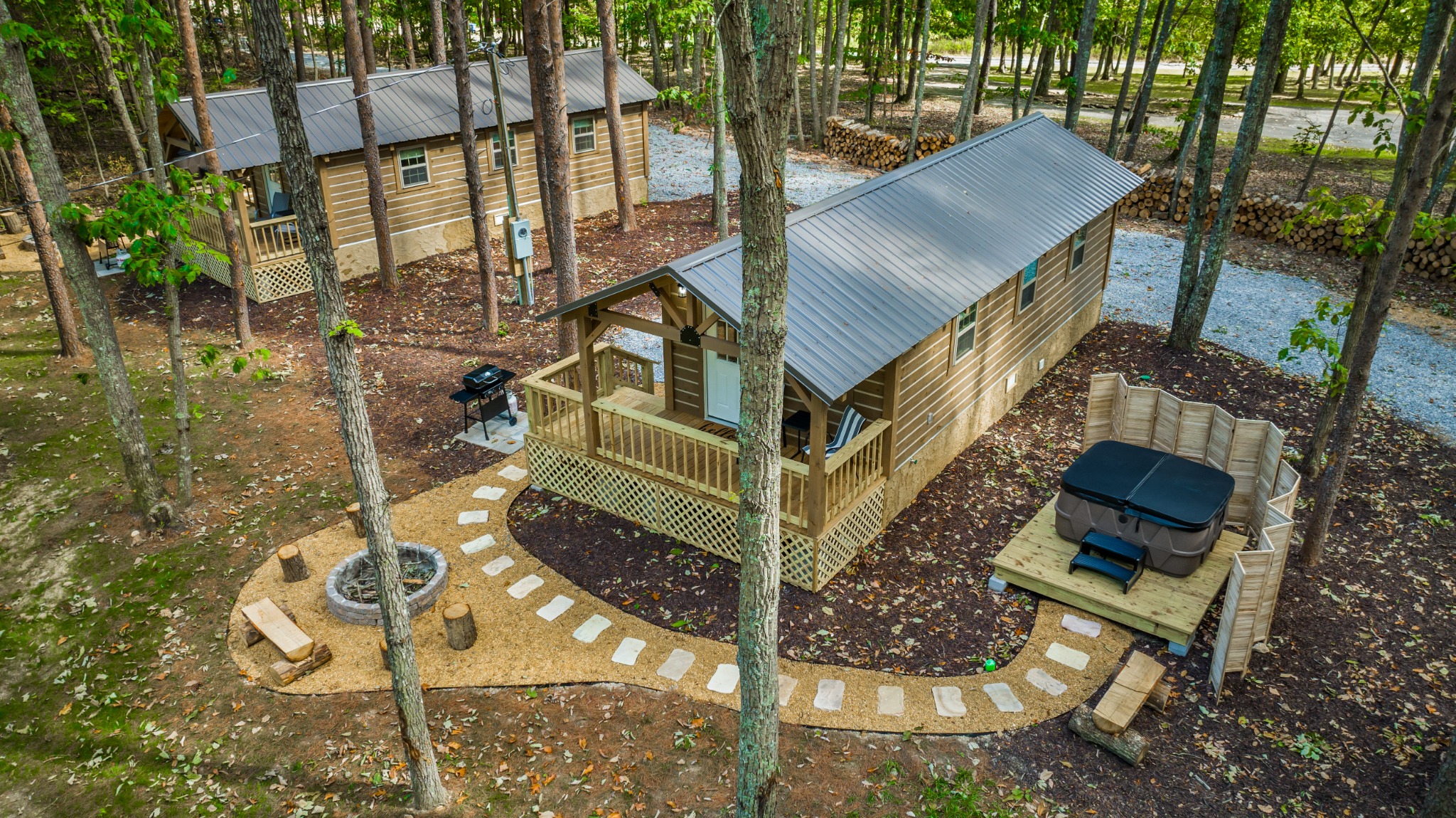 Aerial view of log cabins nestled in the forest