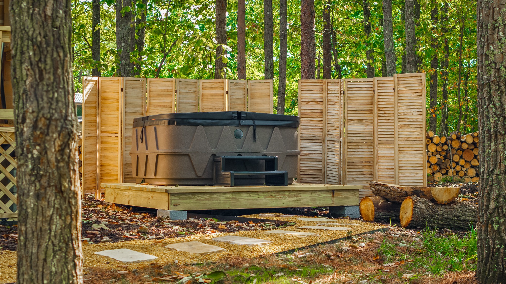 Private hot tub surrounded by trees